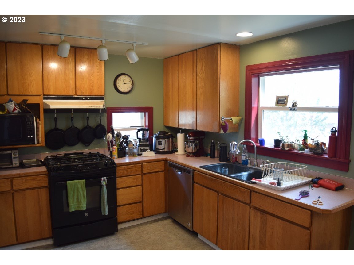 327 West Main Street Athena, OR 97813 - Photo 10 of 48 a kitchen with a sink cabinets and window