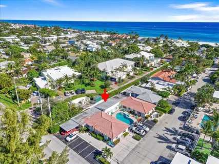 an aerial view of residential houses with outdoor space