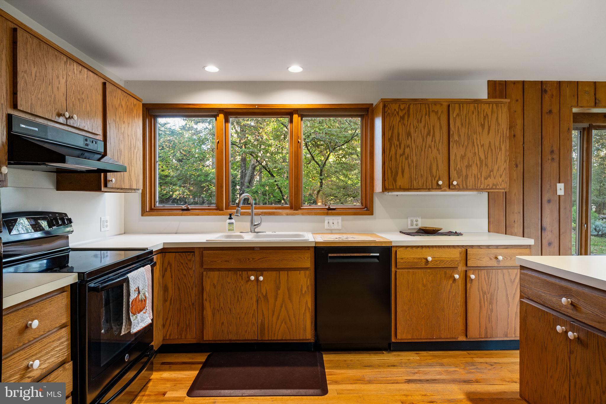 640 Harts Ridge Road Conshohocken, PA 19428 - Photo 15 of 46 a kitchen with stainless steel appliances granite countertop a stove a sink dishwasher and a microwave oven with cabinets