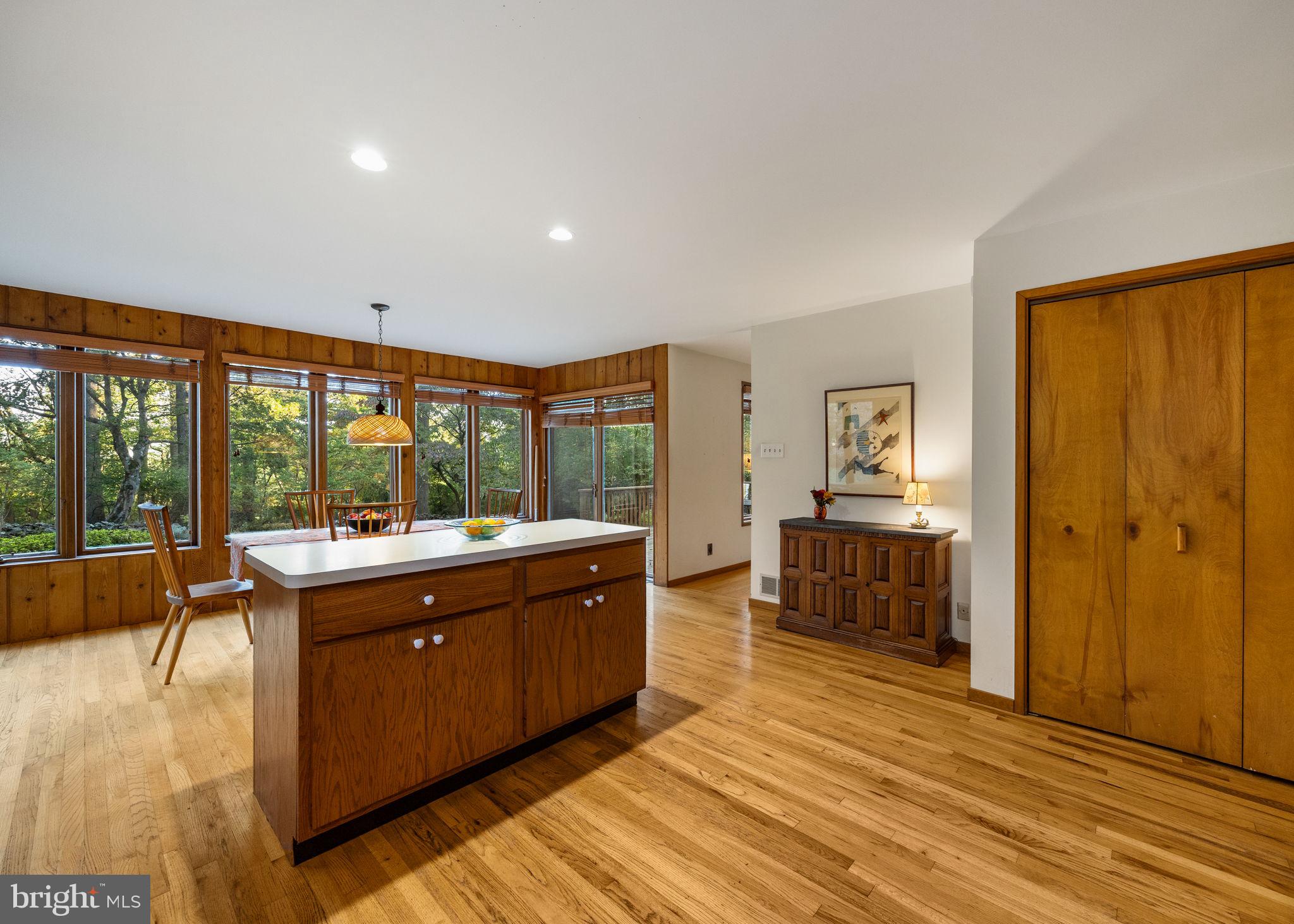 640 Harts Ridge Road Conshohocken, PA 19428 - Photo 16 of 46 a large living room with stainless steel appliances granite countertop a large window and a table chair
