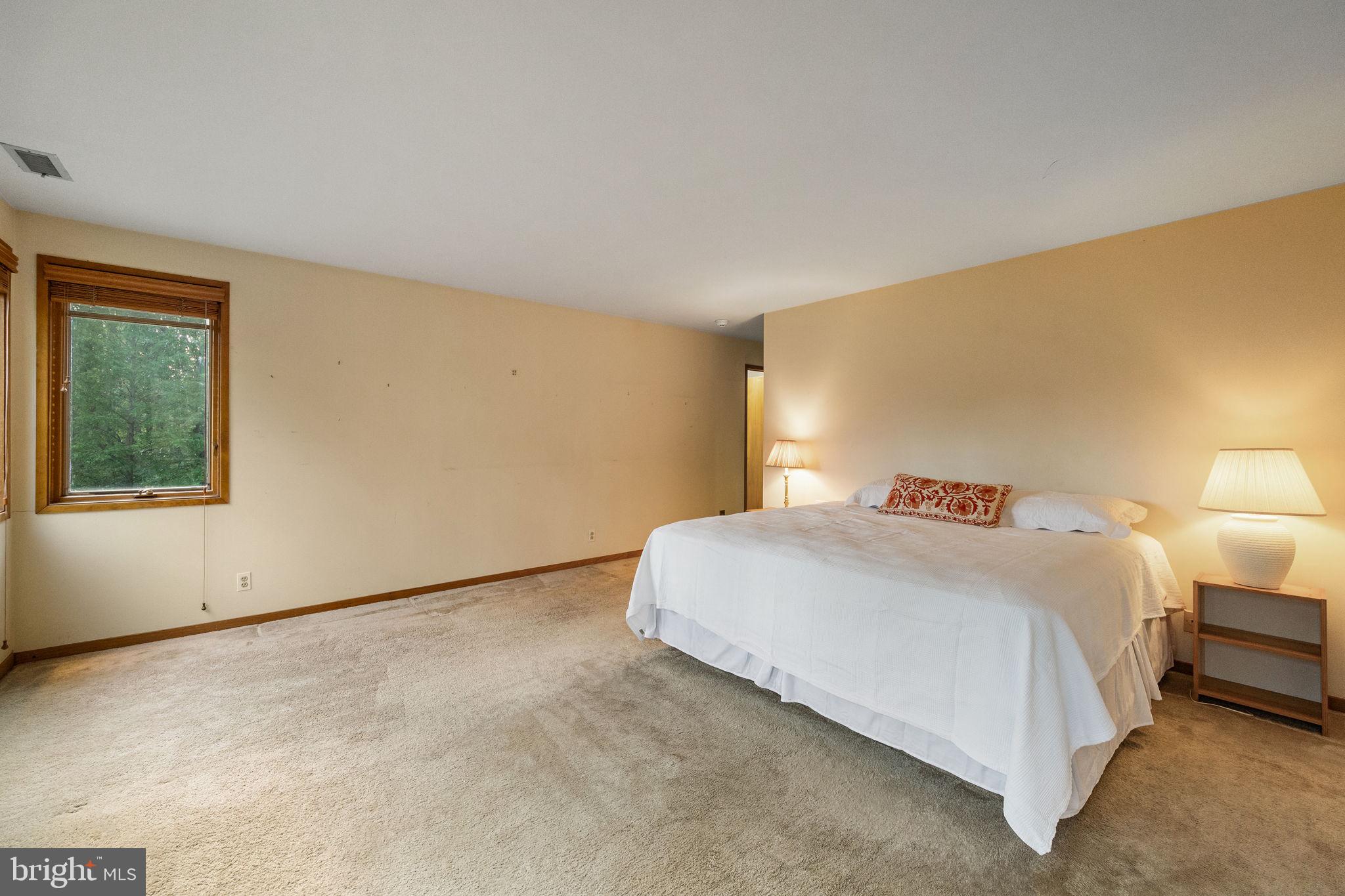 640 Harts Ridge Road Conshohocken, PA 19428 - Photo 23 of 46 a bedroom with a bed and a window