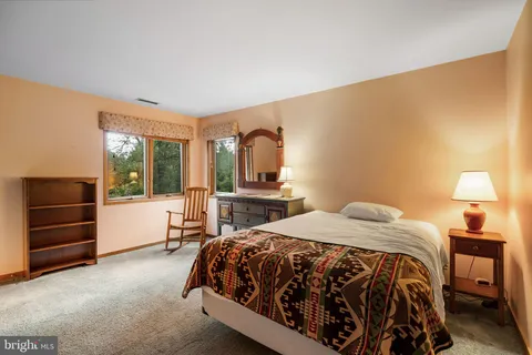 a bedroom with a bed and a cabinets