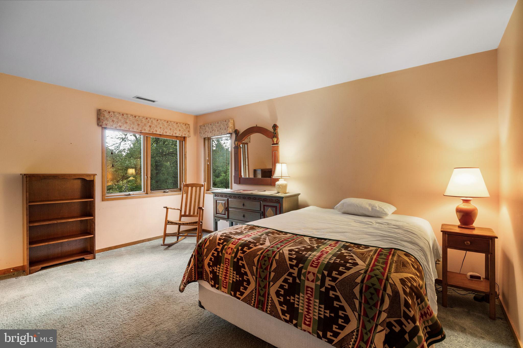 640 Harts Ridge Road Conshohocken, PA 19428 - Photo 35 of 46 a bedroom with a bed and a cabinets