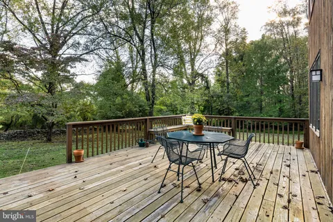 a view of a deck patio and outdoor seating