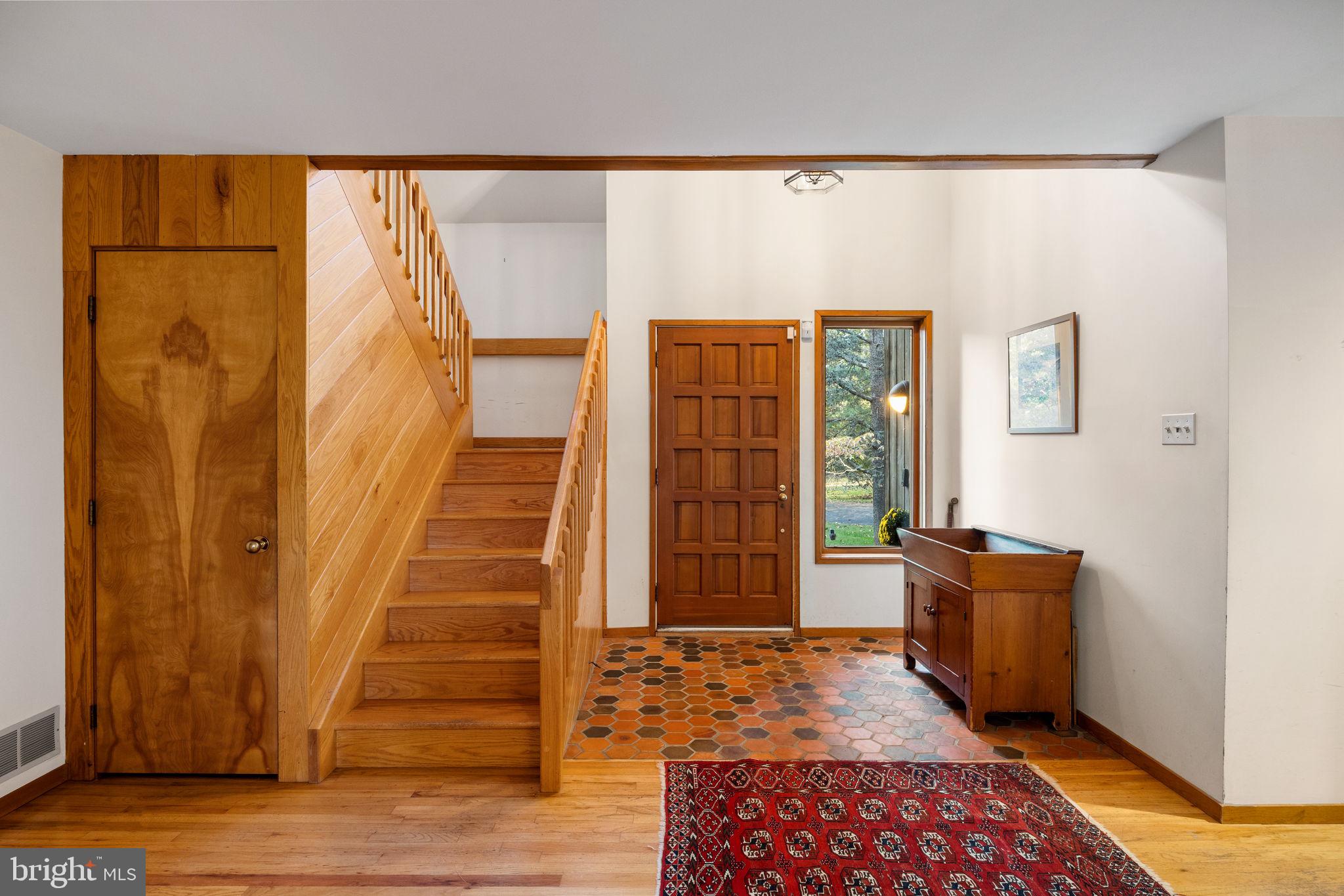 640 Harts Ridge Road Conshohocken, PA 19428 - Photo 5 of 46 a view of a hallway with wooden floor and windows
