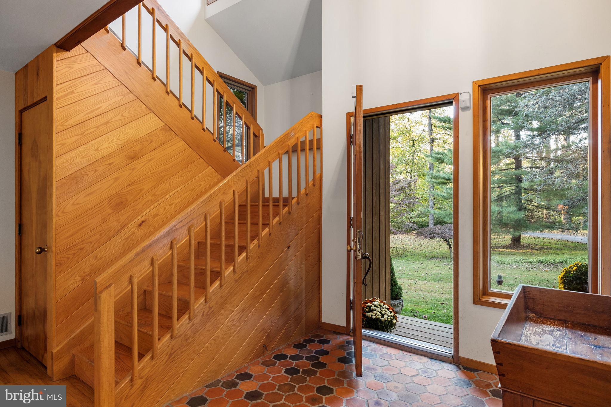 640 Harts Ridge Road Conshohocken, PA 19428 - Photo 6 of 46 a view of staircase with wooden floor and a potted plant