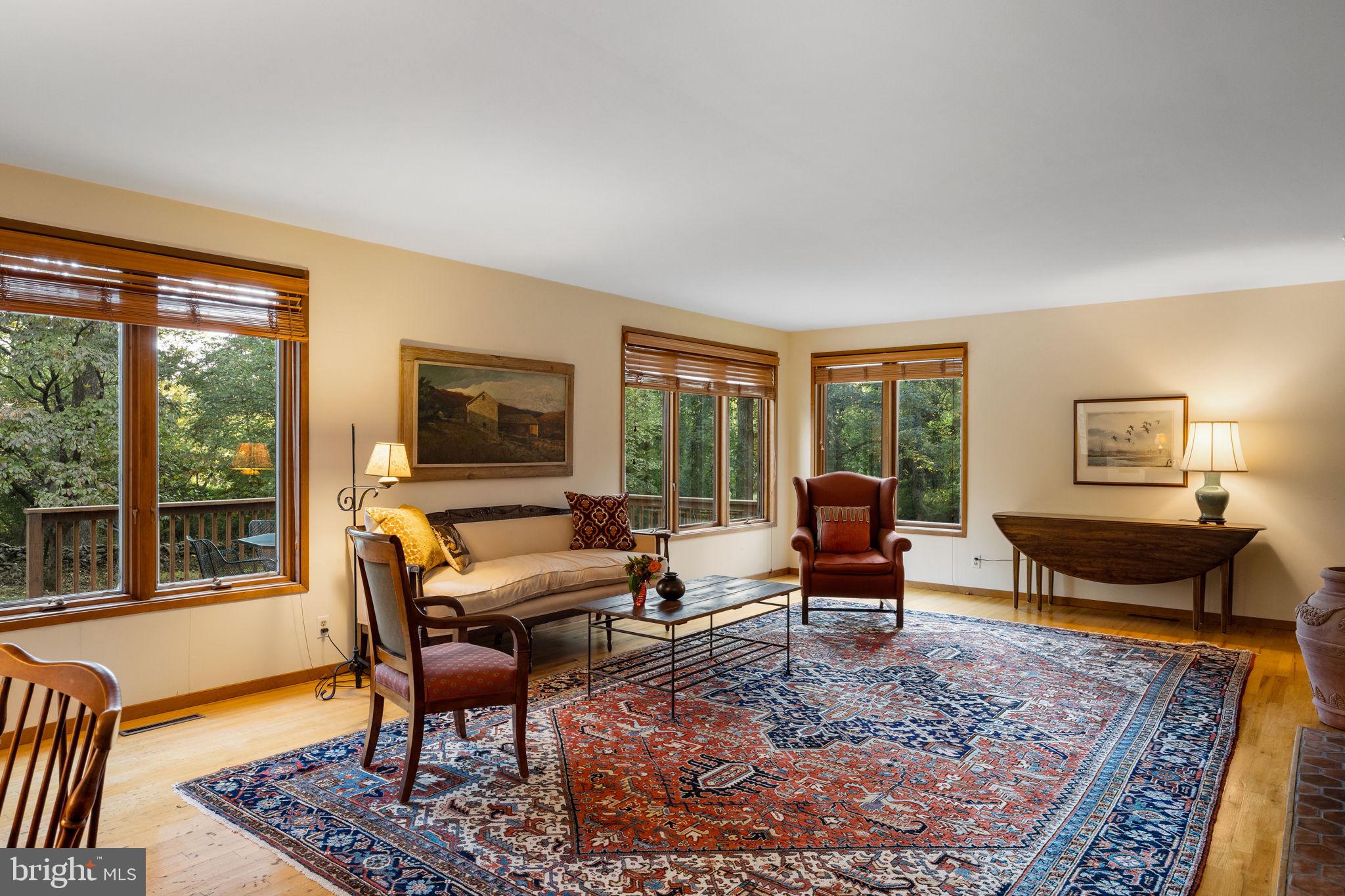 640 Harts Ridge Road Conshohocken, PA 19428 - Photo 8 of 46 a living room with furniture large windows and wooden floor