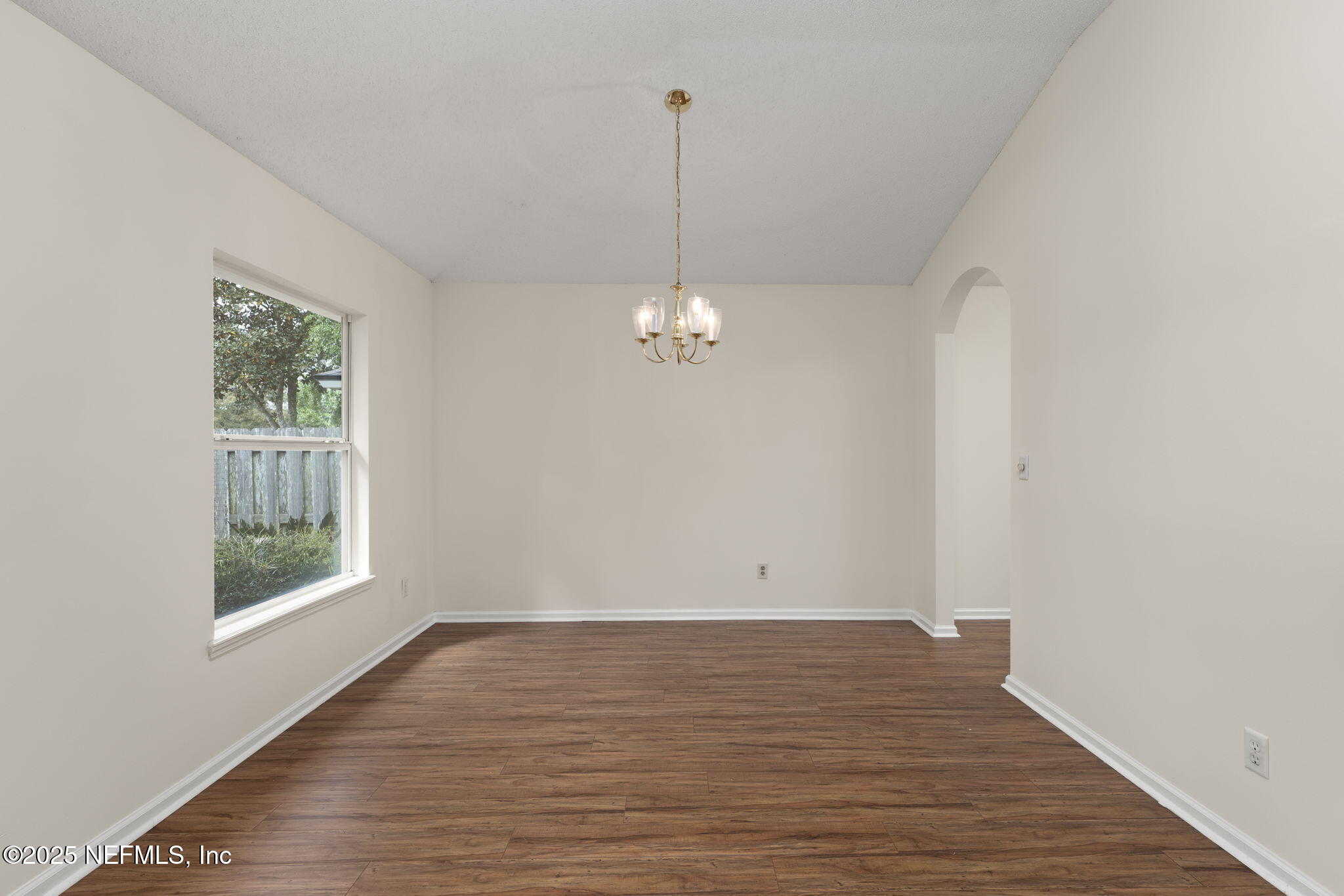 844 MacKenzie Circle St. Augustine, FL 32092 - Photo 13 of 40 wooden floor in an empty room with a window
