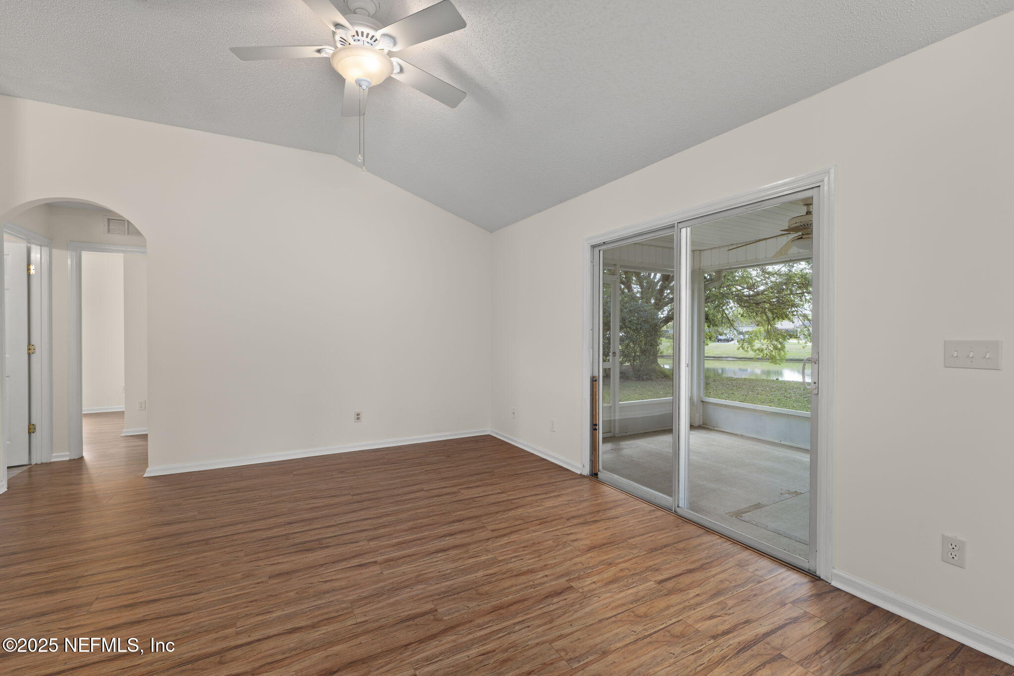 844 MacKenzie Circle St. Augustine, FL 32092 - Photo 16 of 40 wooden floor in an empty room with a window