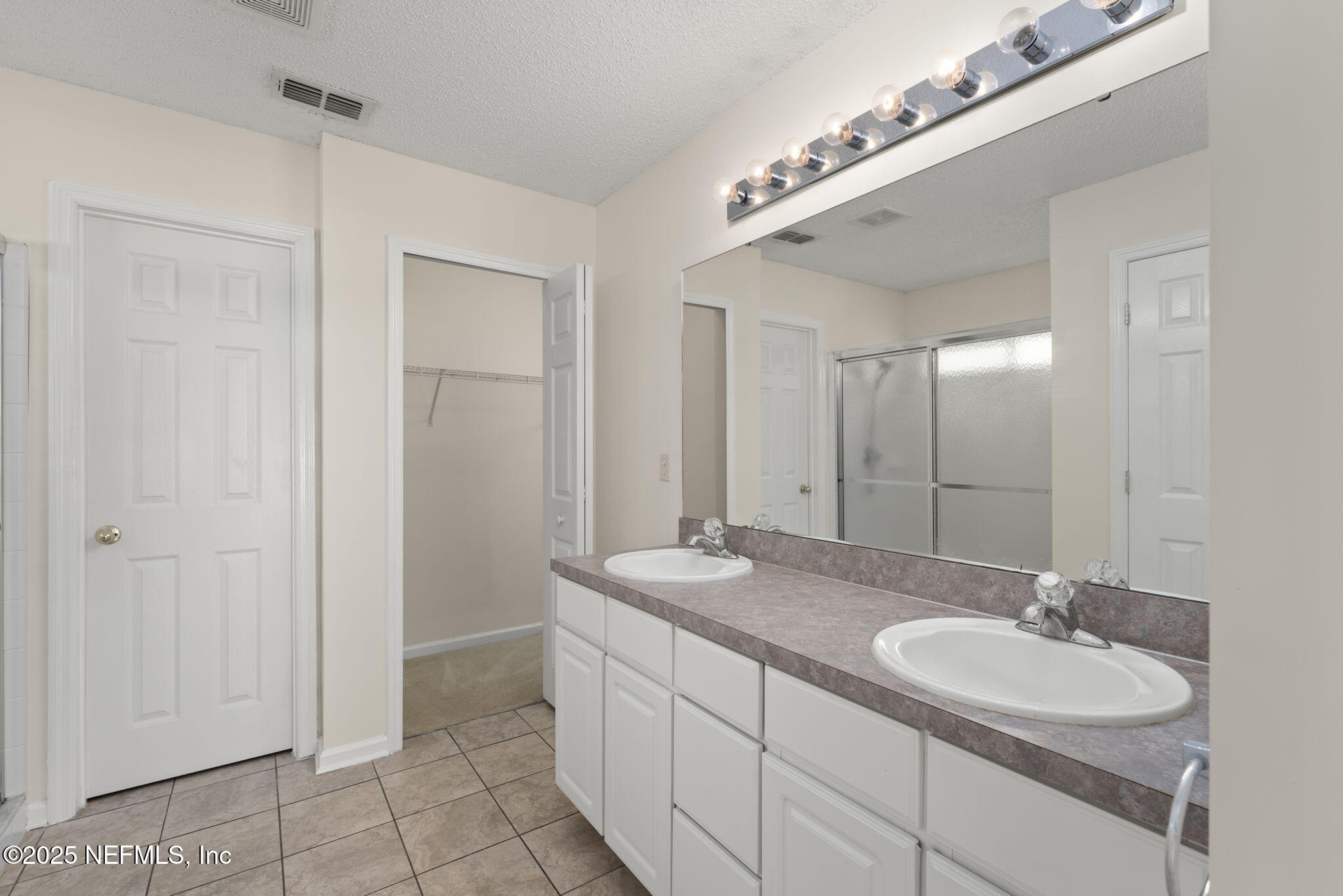 844 MacKenzie Circle St. Augustine, FL 32092 - Photo 21 of 40 a bathroom with a granite countertop sink and a mirror