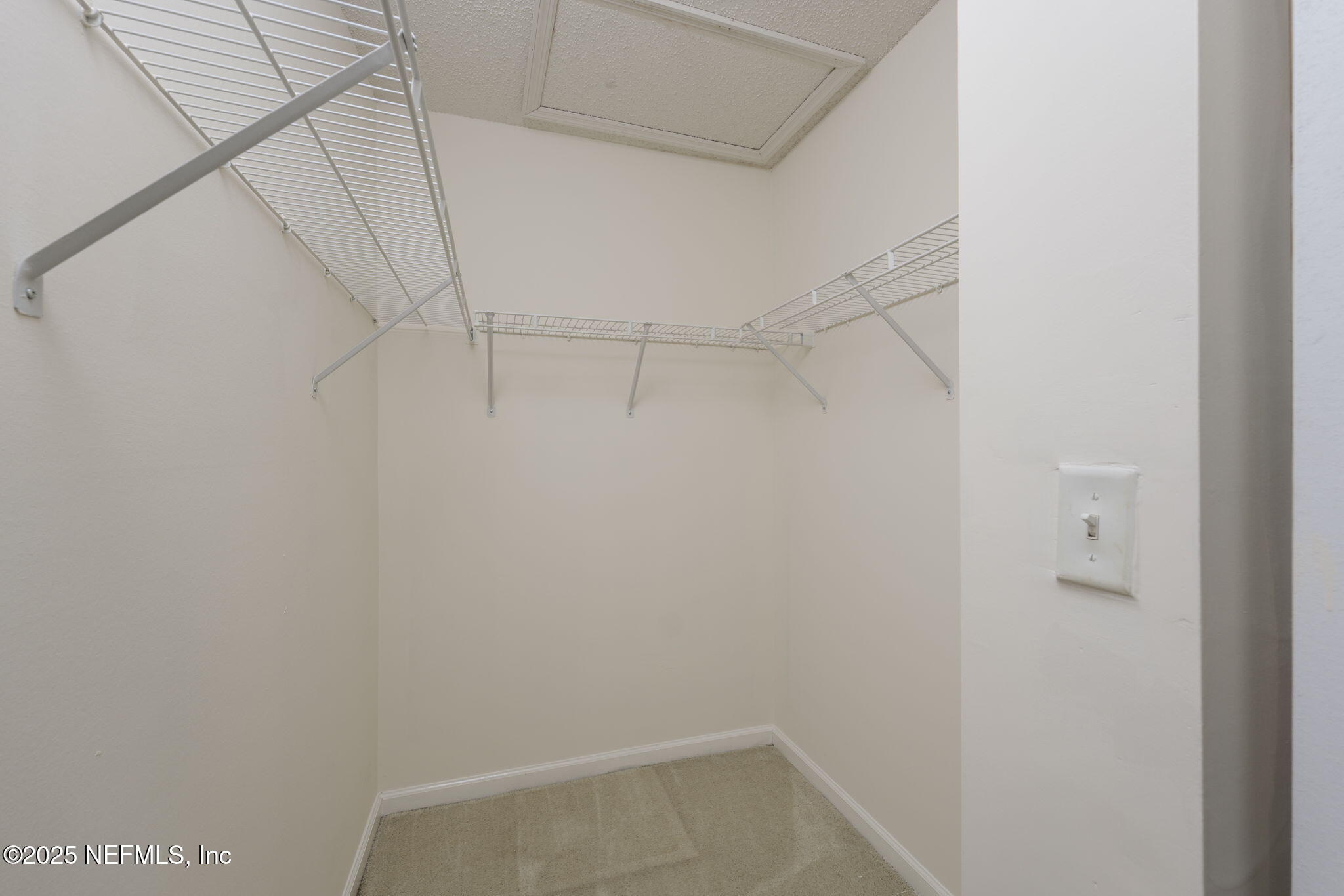 844 MacKenzie Circle St. Augustine, FL 32092 - Photo 22 of 40 a view of a room with racks on the wall