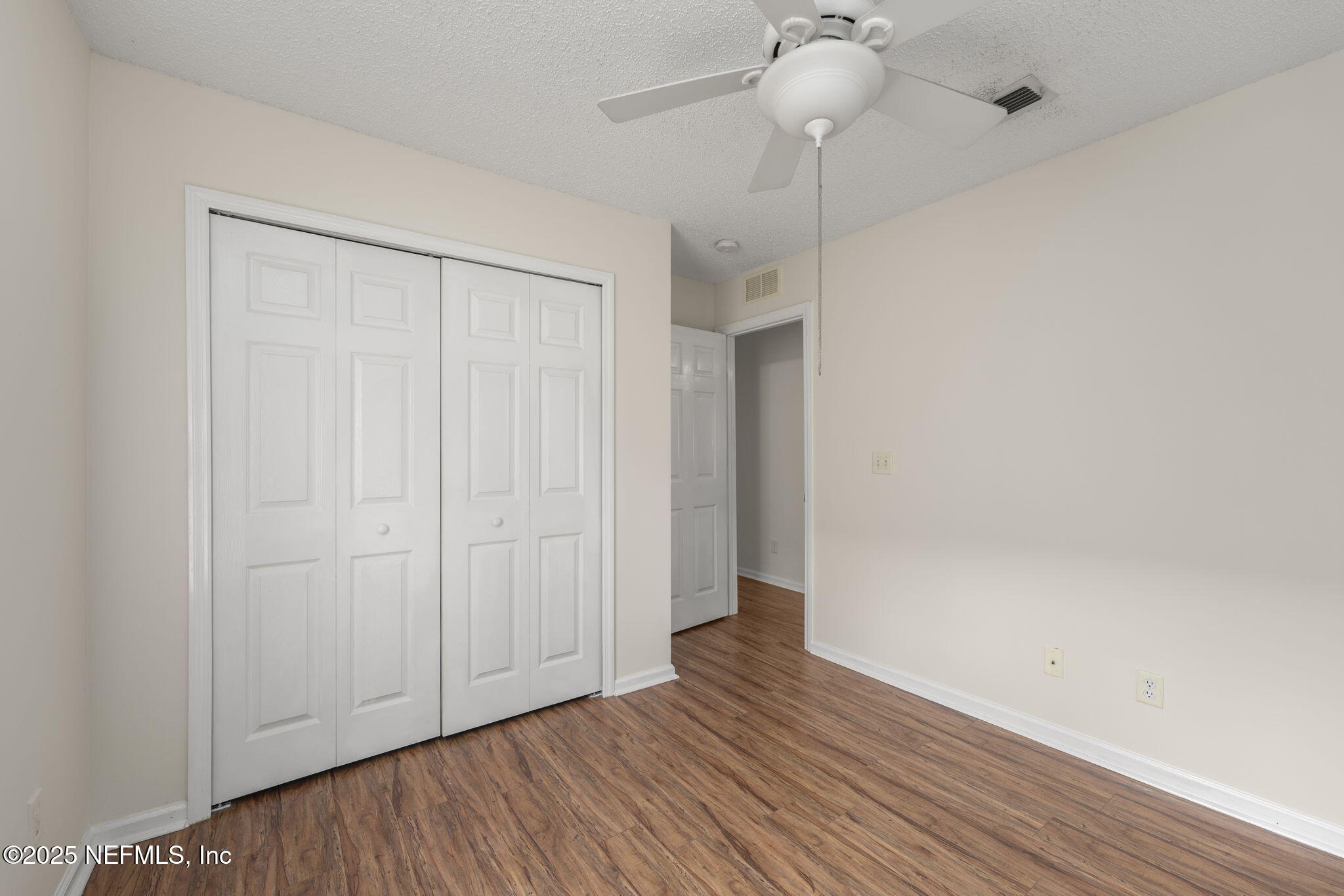 844 MacKenzie Circle St. Augustine, FL 32092 - Photo 24 of 40 a view of an empty room with wooden floor