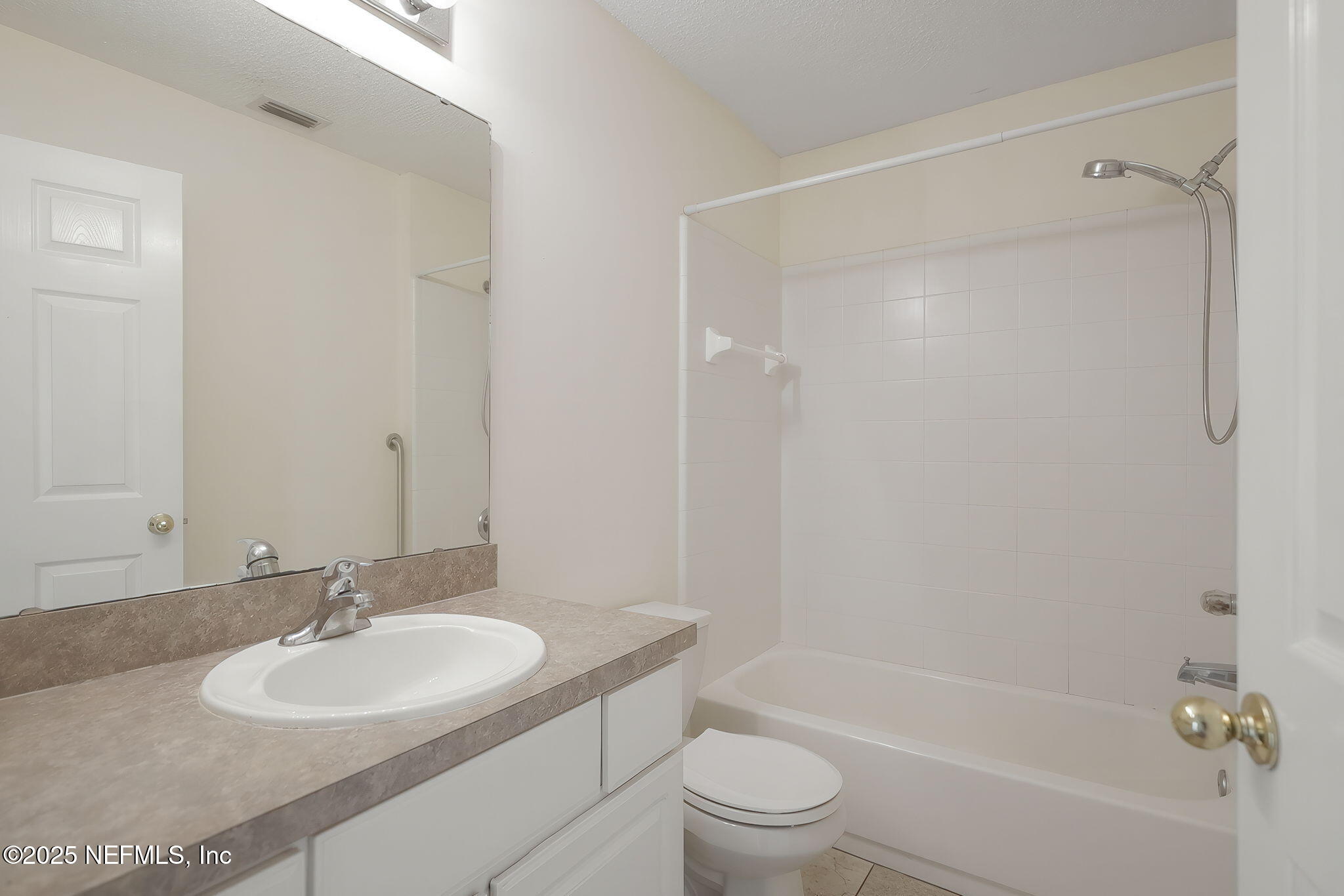 844 MacKenzie Circle St. Augustine, FL 32092 - Photo 25 of 40 a bathroom with a granite countertop sink toilet and shower