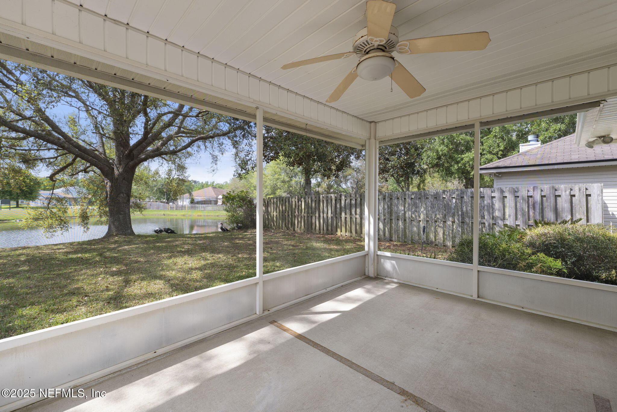 844 MacKenzie Circle St. Augustine, FL 32092 - Photo 28 of 40 a view of a room with a large tree and wooden fence