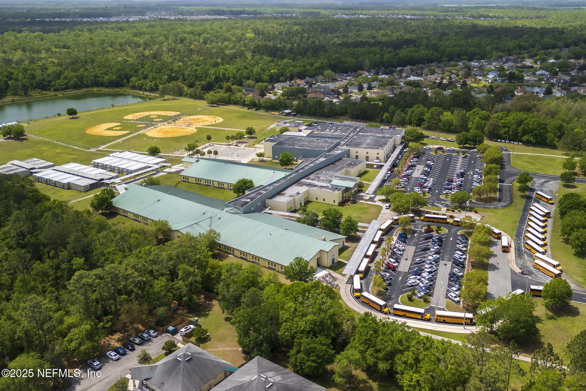 844 MacKenzie Circle St. Augustine, FL 32092 - Photo 40 of 40 an aerial view of residential houses with outdoor space and swimming pool