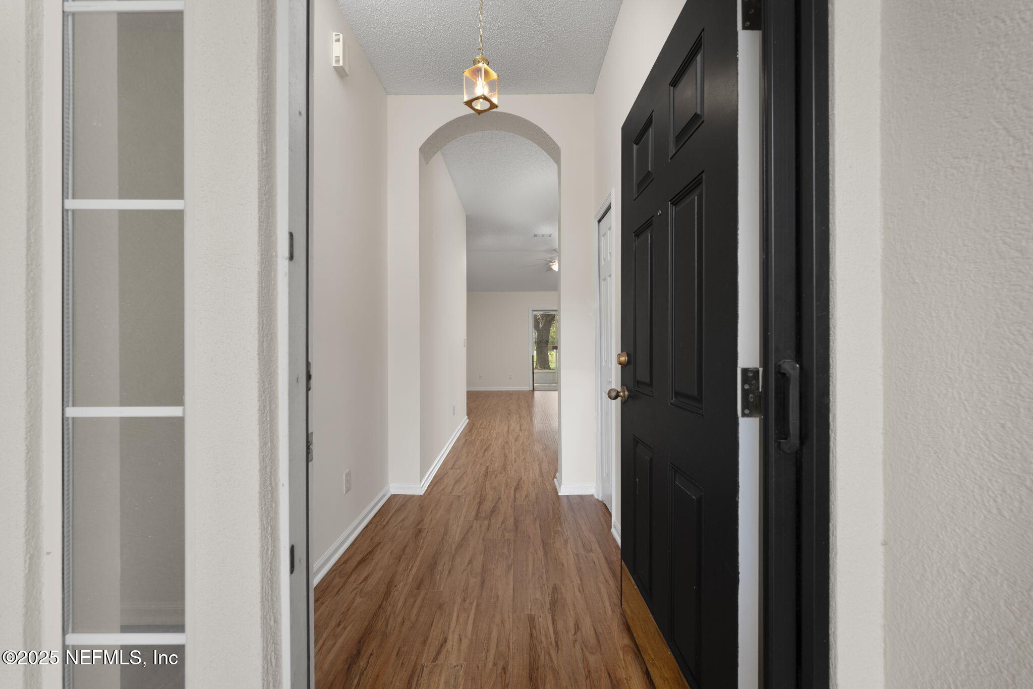 844 MacKenzie Circle St. Augustine, FL 32092 - Photo 5 of 40 a view of a hallway with wooden floor