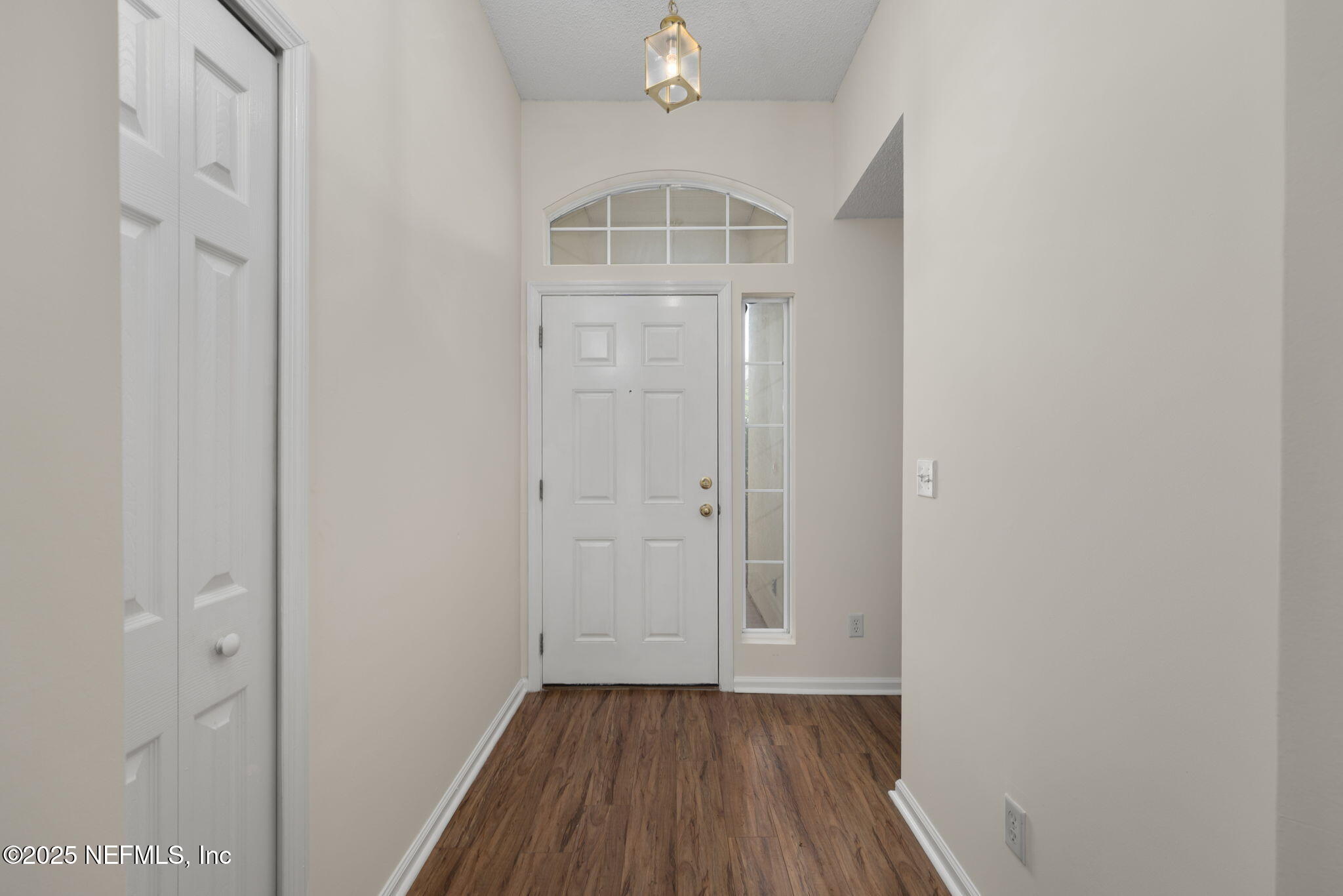 844 MacKenzie Circle St. Augustine, FL 32092 - Photo 6 of 40 a view of a hallway with wooden floor