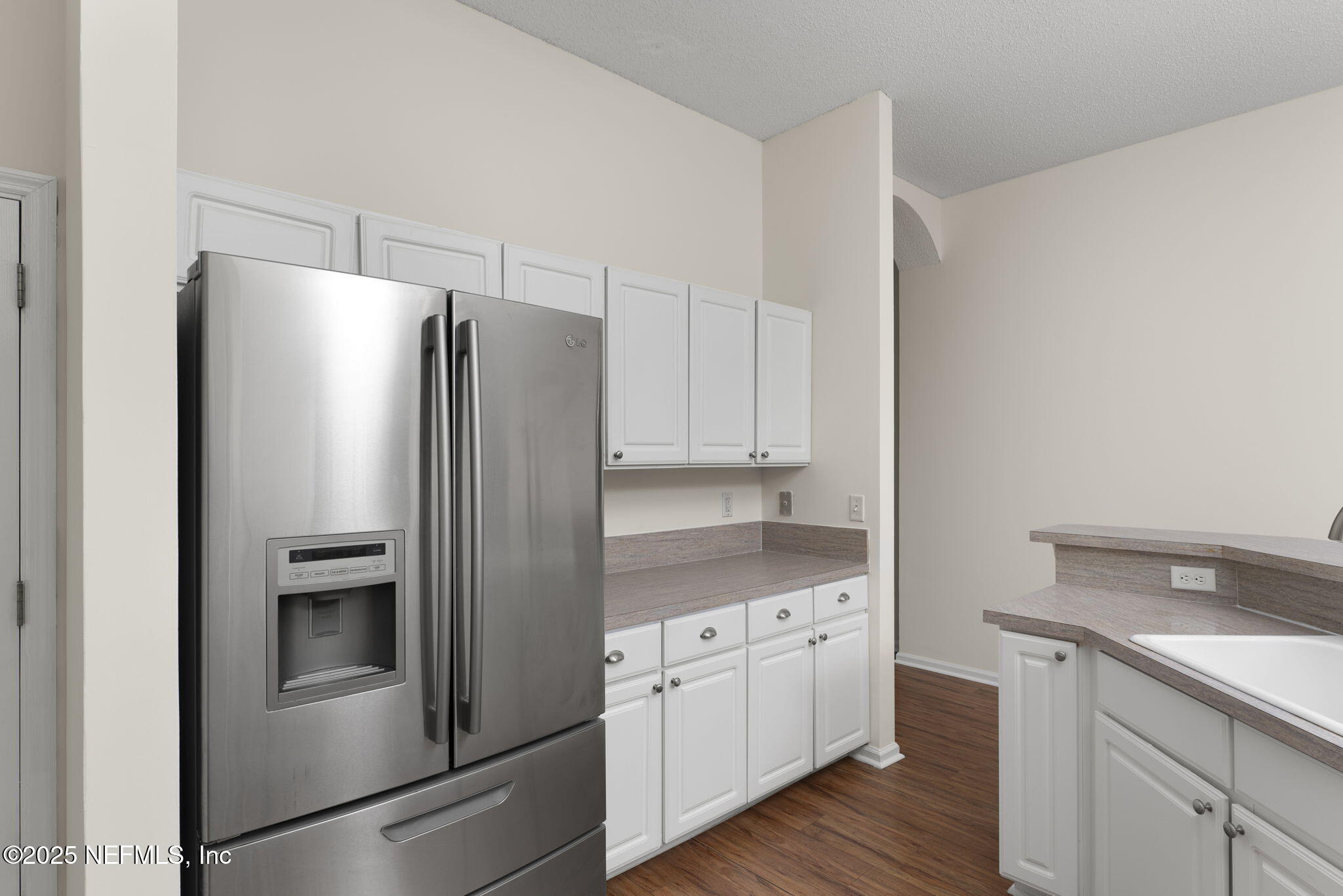 844 MacKenzie Circle St. Augustine, FL 32092 - Photo 9 of 40 a kitchen with stainless steel appliances a refrigerator sink and cabinets