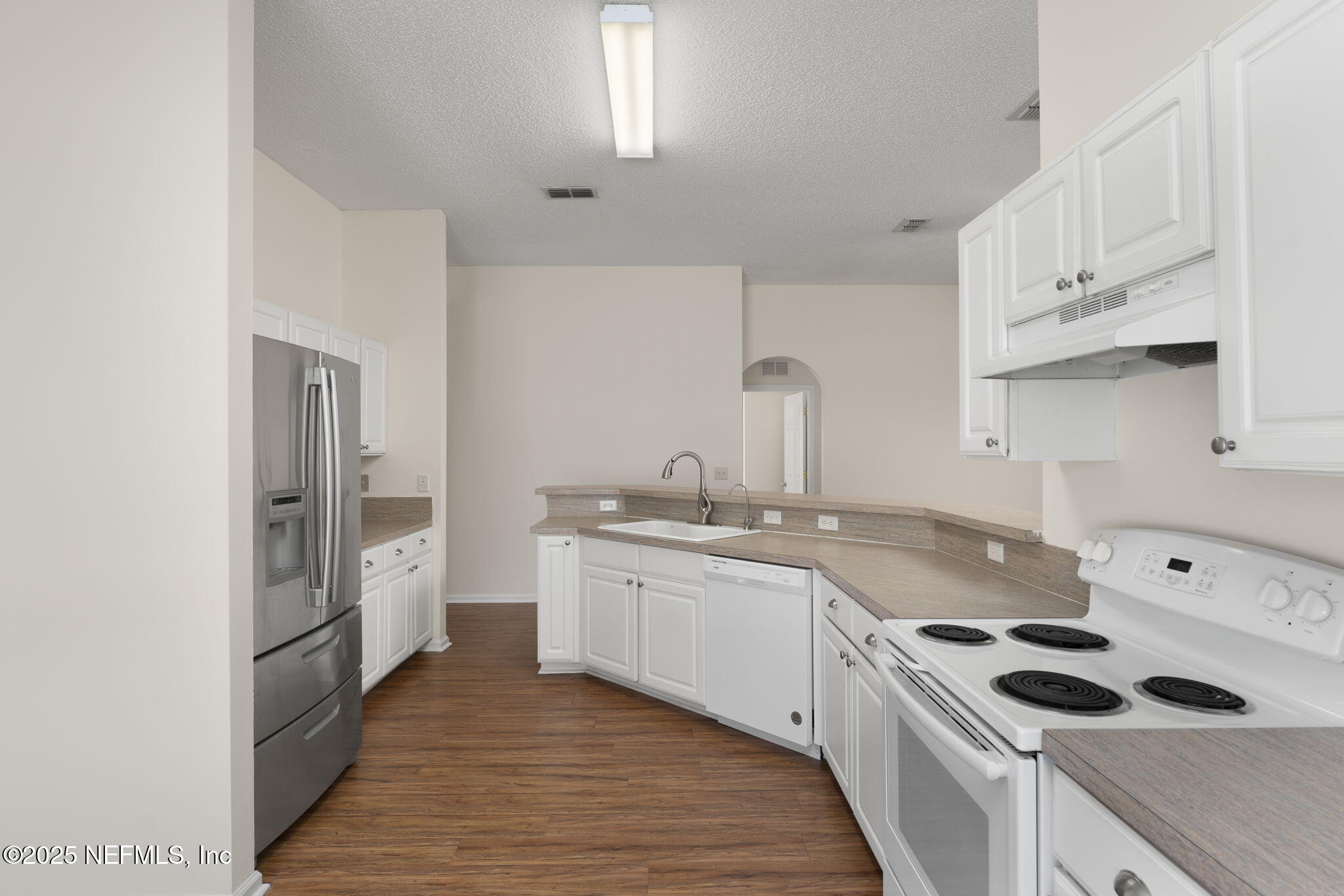 844 MacKenzie Circle St. Augustine, FL 32092 - Photo 10 of 40 a kitchen with stainless steel appliances granite countertop a sink stove and refrigerator