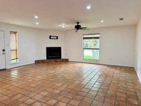 5045 Thunder Road Dallas, TX 75244 - Photo 4 of 28 a view of empty room with wooden floor and window