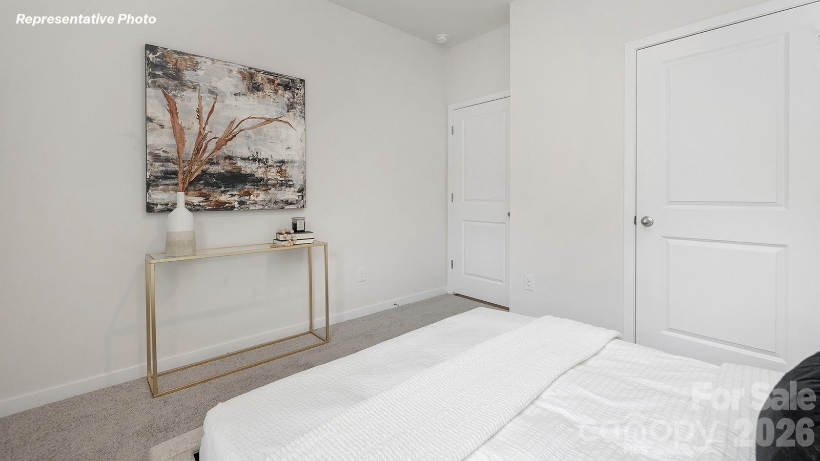 239 Superstar Street Salisbury, NC 28147 - Photo 11 of 28 a bedroom with a bed and a white cabinet
