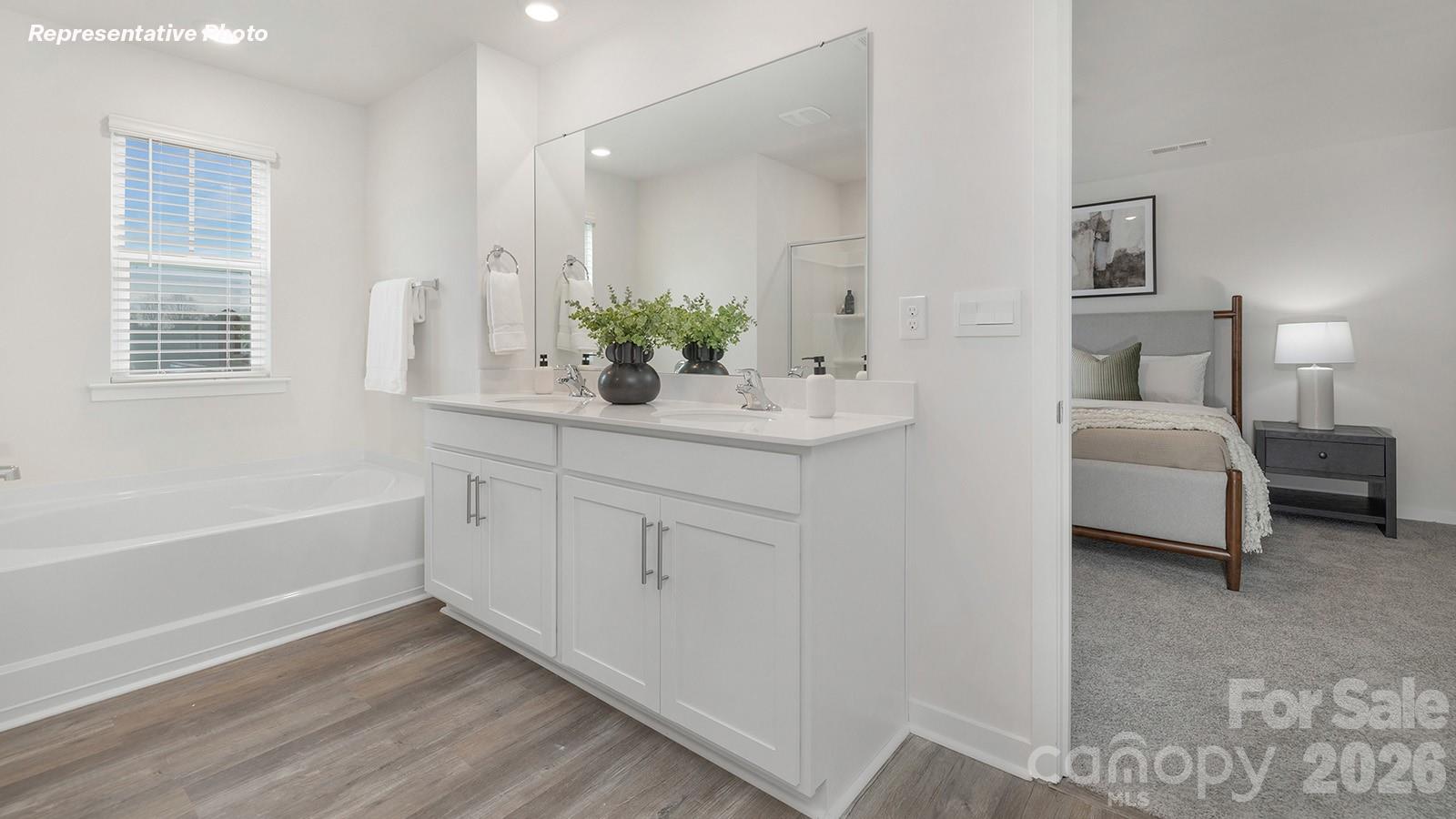 239 Superstar Street Salisbury, NC 28147 - Photo 17 of 28 a bathroom with a double vanity sink and mirror