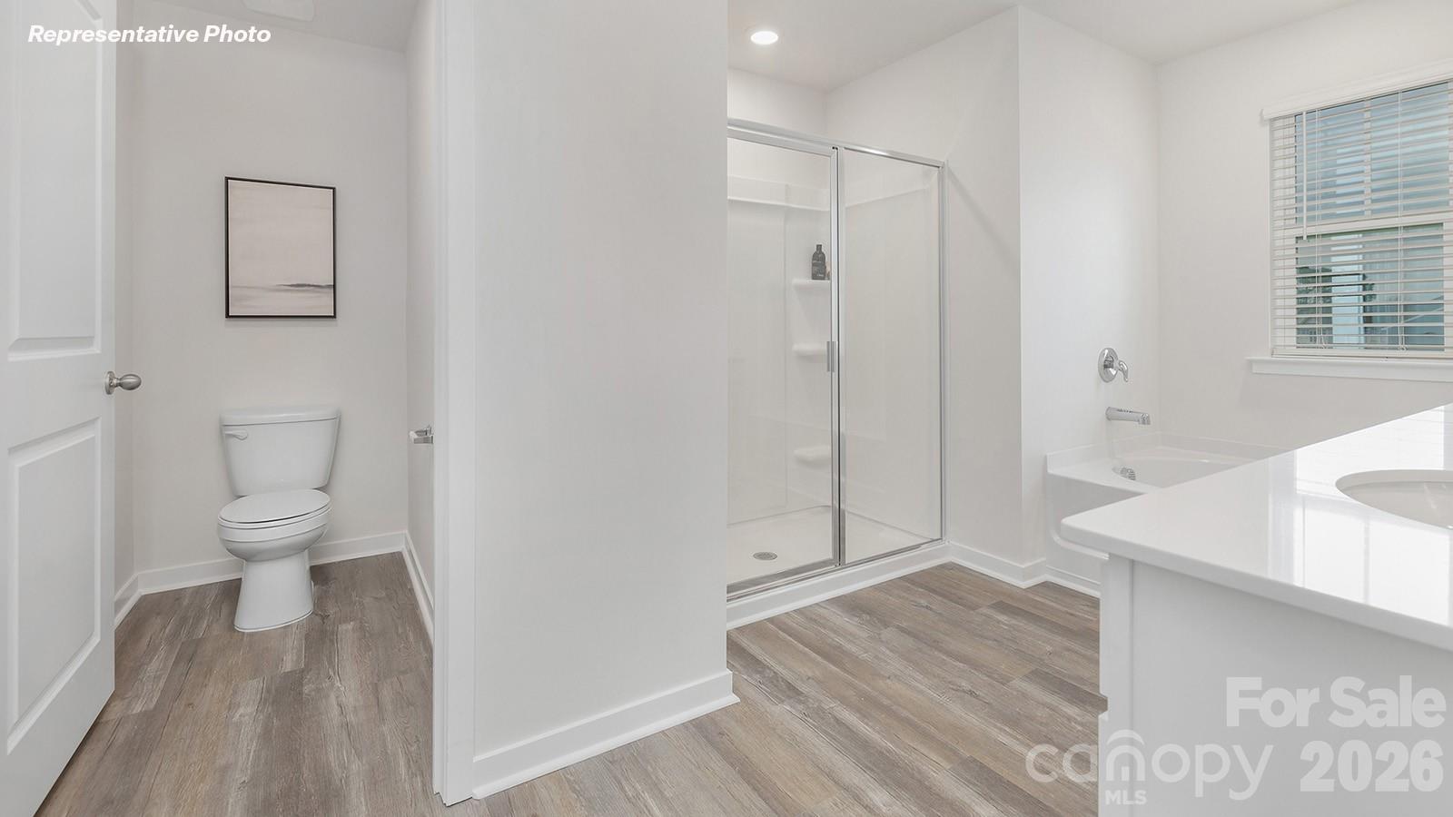239 Superstar Street Salisbury, NC 28147 - Photo 18 of 28 a bathroom with a sink toilet and shower
