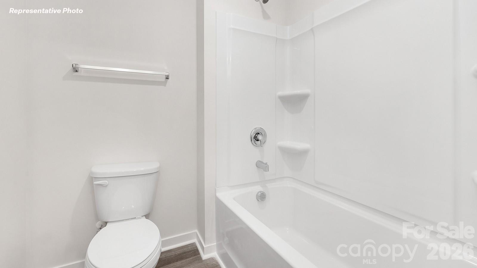 239 Superstar Street Salisbury, NC 28147 - Photo 25 of 28 a bathroom with a toilet and bathtub