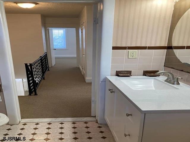 432 Wisteria Road Atlantic City, NJ 08401 - Photo 14 of 22 a bathroom with a sink and a mirror