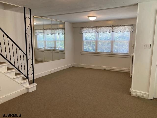 432 Wisteria Road Atlantic City, NJ 08401 - Photo 3 of 22 an empty room with wooden floor and windows
