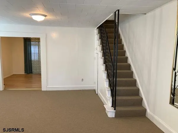 a view of entryway with wooden floor