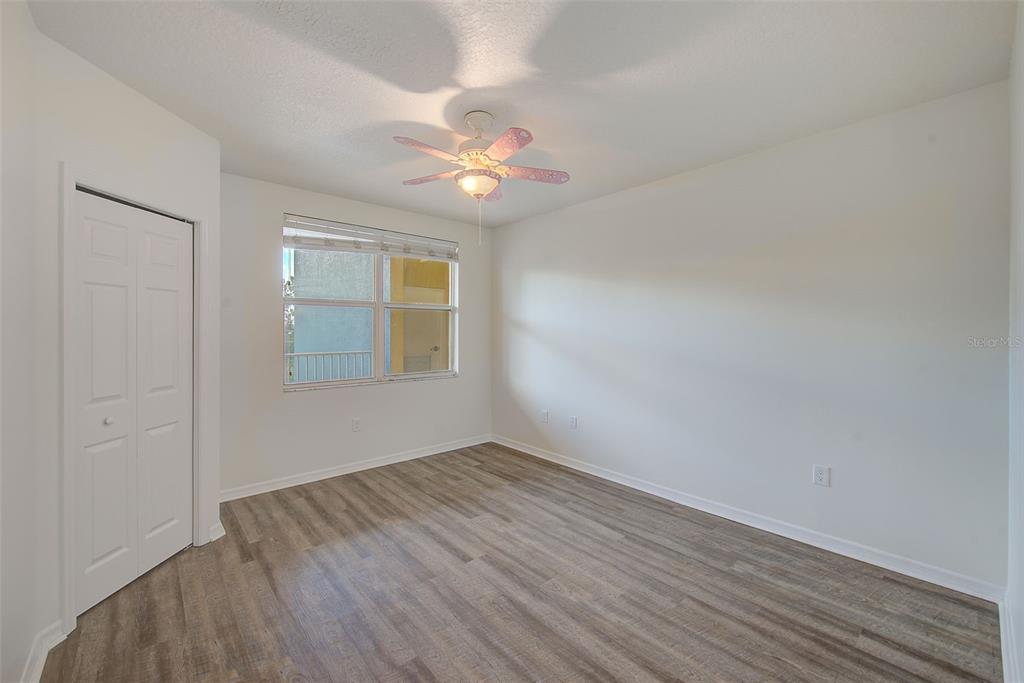 960 Starkey Road, Unit 3302 Largo, FL 33771 - Photo 17 of 28 wooden floor in an empty room with a window