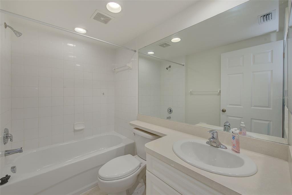960 Starkey Road, Unit 3302 Largo, FL 33771 - Photo 18 of 28 a bathroom with a sink toilet and shower