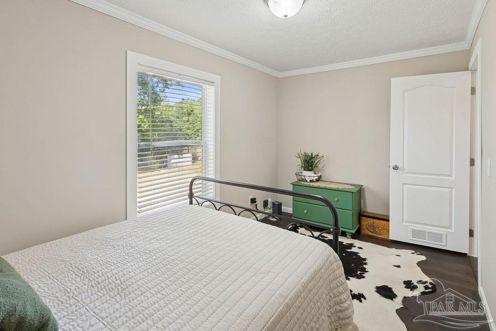 10309 Highway 89 Jay, FL 32565 - Photo 15 of 28 a bedroom with a bed and a window