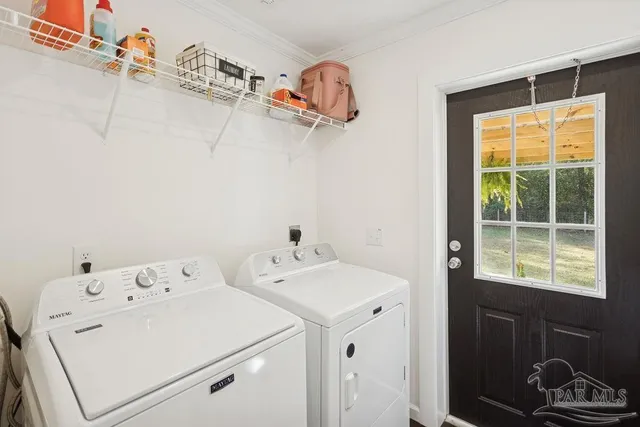 a utility room with dryer and washer