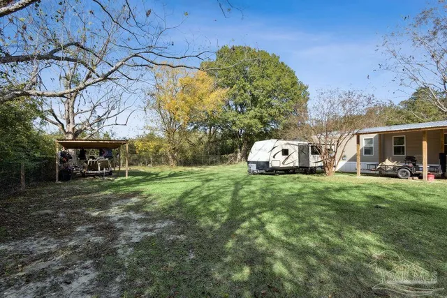 a view of a back yard of the house
