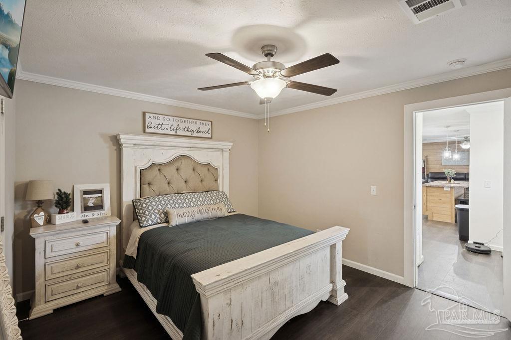 10309 Highway 89 Jay, FL 32565 - Photo 8 of 28 a bedroom with a bed and a walk in closet