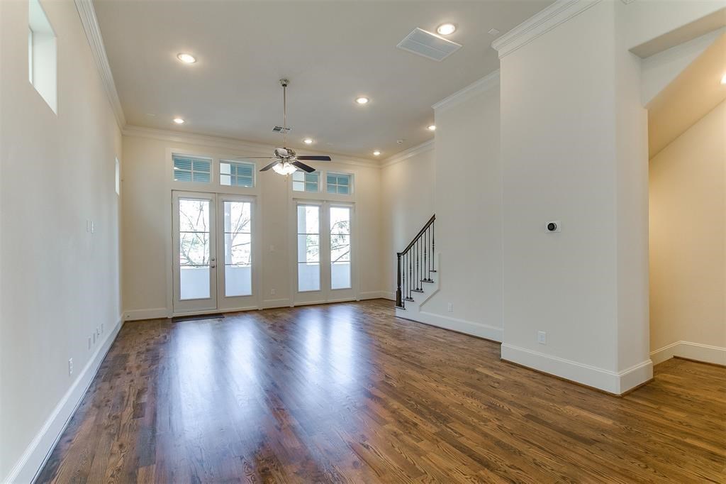 2010 Beall Street Houston, TX 77008 - Photo 12 of 17 a view of an empty room with wooden floor and a window