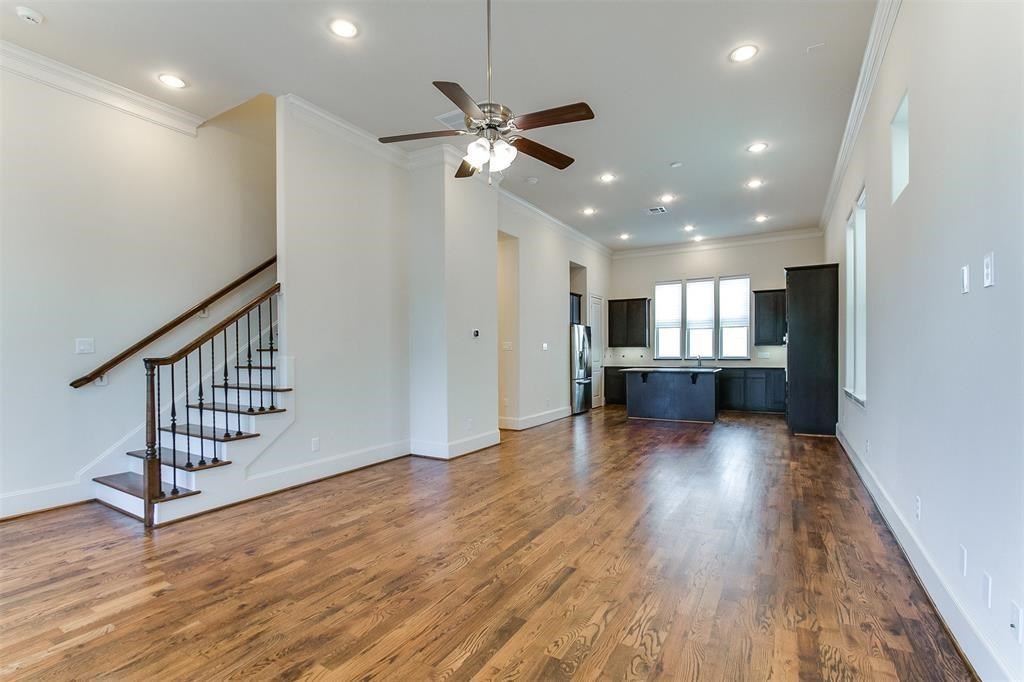 2010 Beall Street Houston, TX 77008 - Photo 13 of 17 a view of a hallway with wooden floor and staircase
