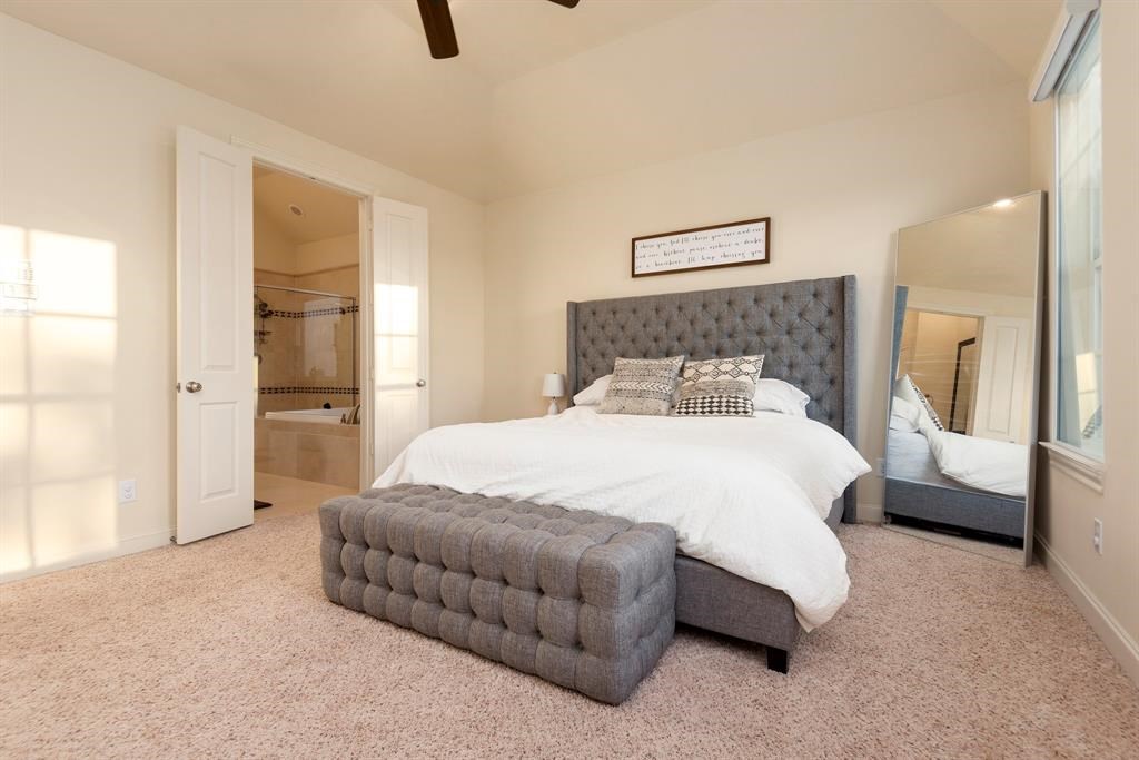 2010 Beall Street Houston, TX 77008 - Photo 10 of 17 a bedroom with a bed and a couch