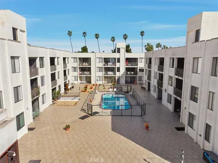 a kitchen with a refrigerator and cabinets