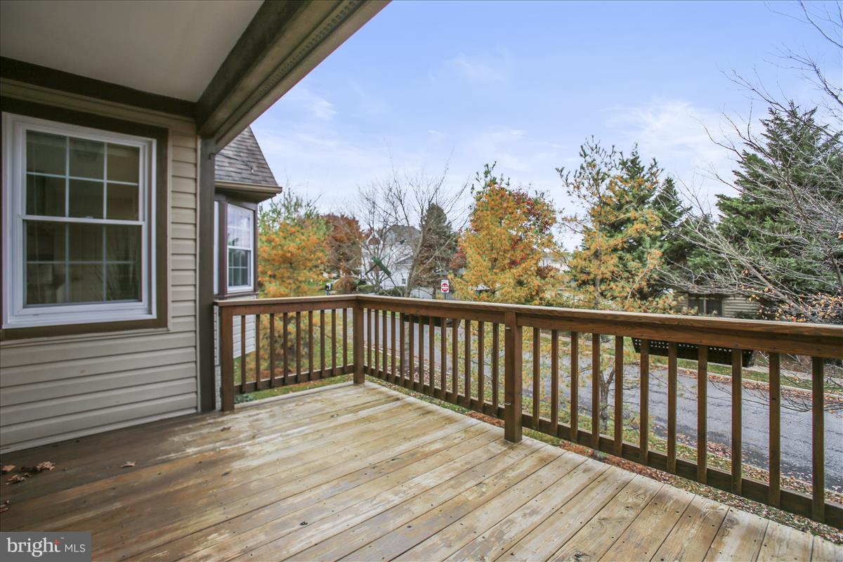 2381 Bear Den Road Frederick, MD 21701 - Photo 3 of 11 a view of balcony with wooden floor and fence