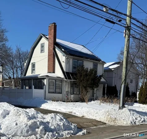 a view of house with a yard
