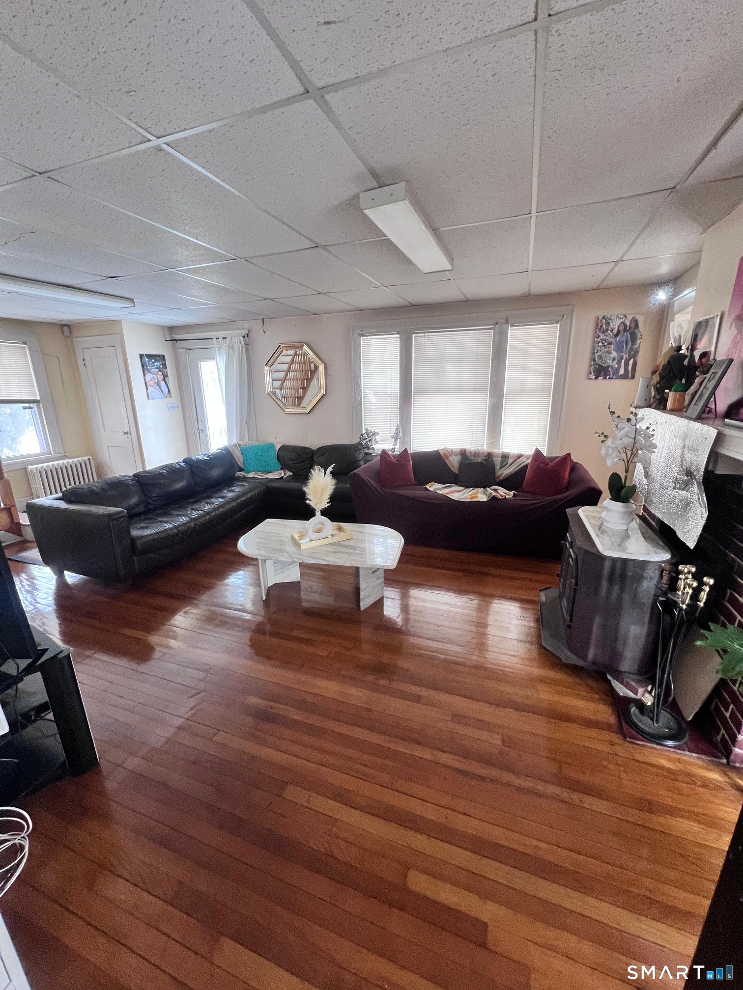 3461 East Main Street Bridgeport, CT 06606 - Photo 11 of 68 a living room with furniture and a wooden floor
