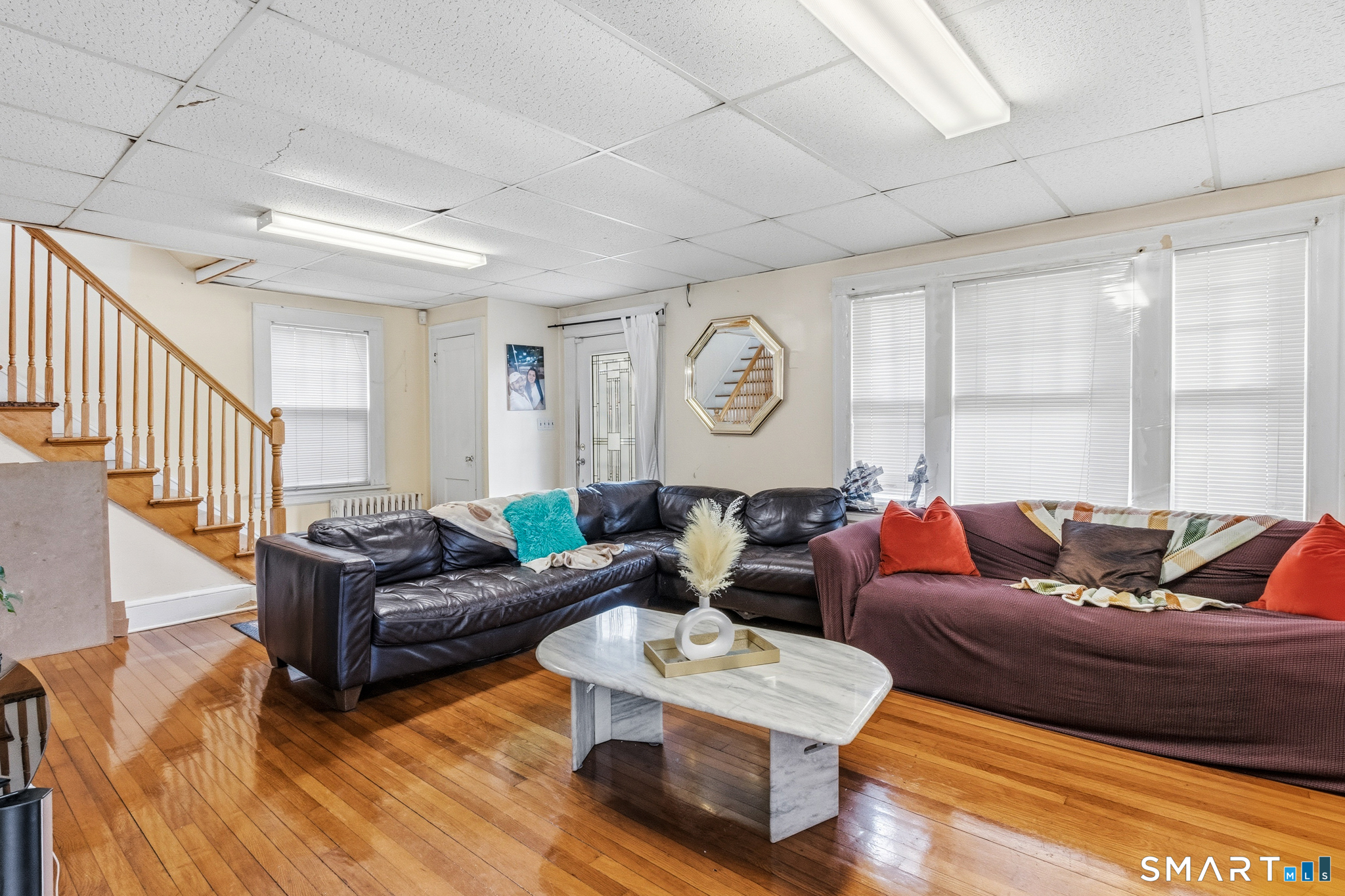 3461 East Main Street Bridgeport, CT 06606 - Photo 12 of 68 a living room with furniture and a large window