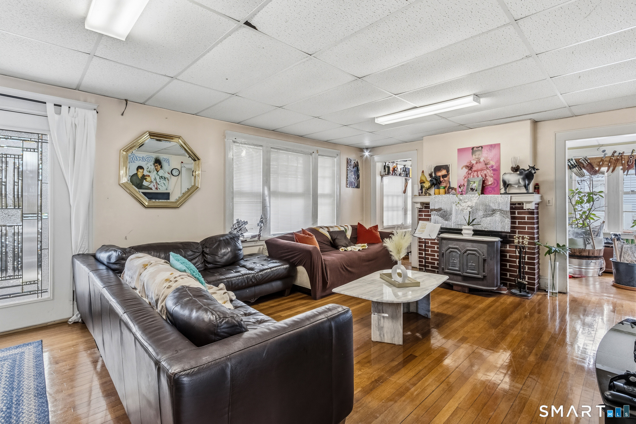 3461 East Main Street Bridgeport, CT 06606 - Photo 14 of 68 a living room with furniture and a flat screen tv