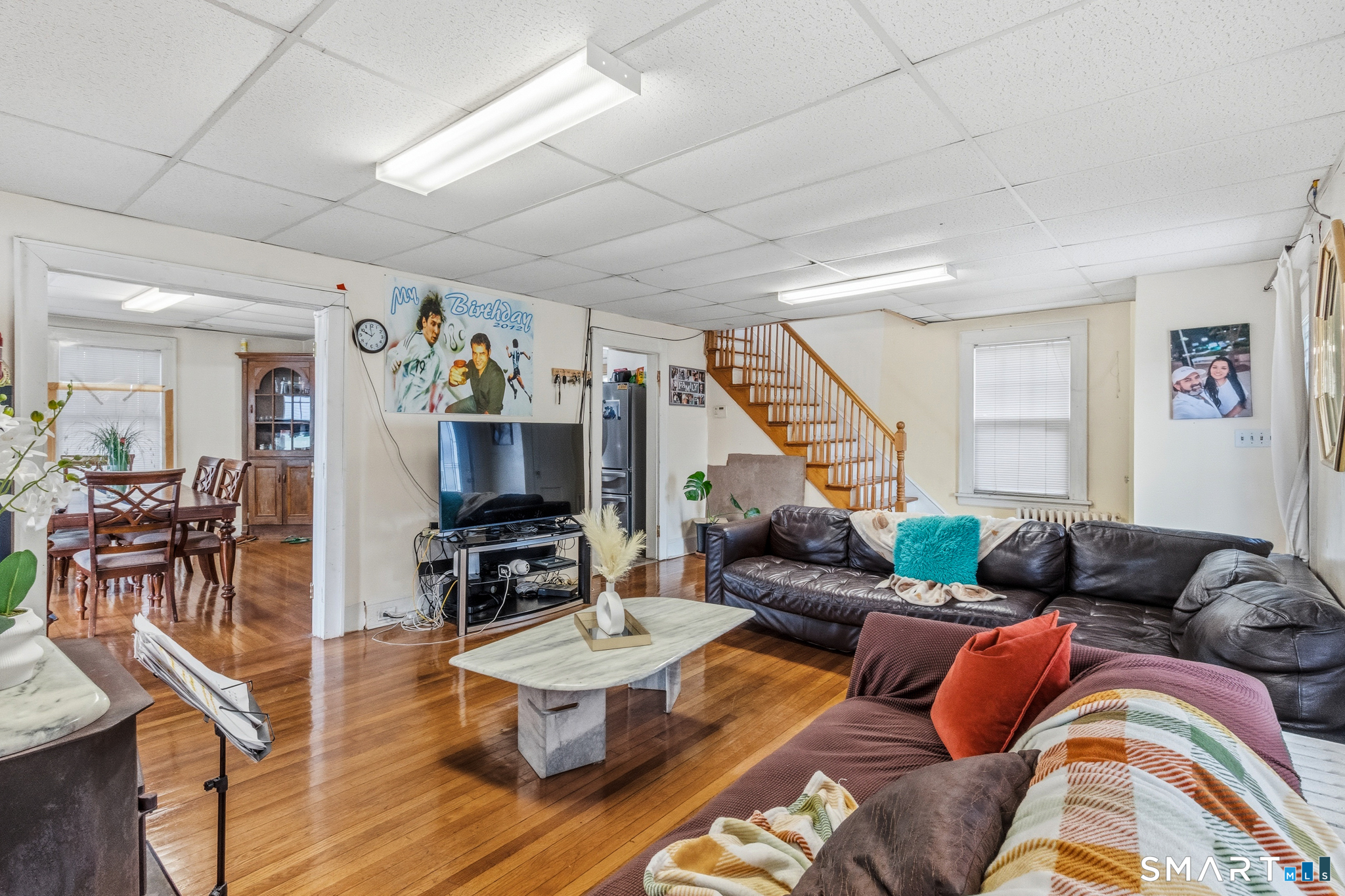 3461 East Main Street Bridgeport, CT 06606 - Photo 16 of 68 a living room with furniture and wooden floor