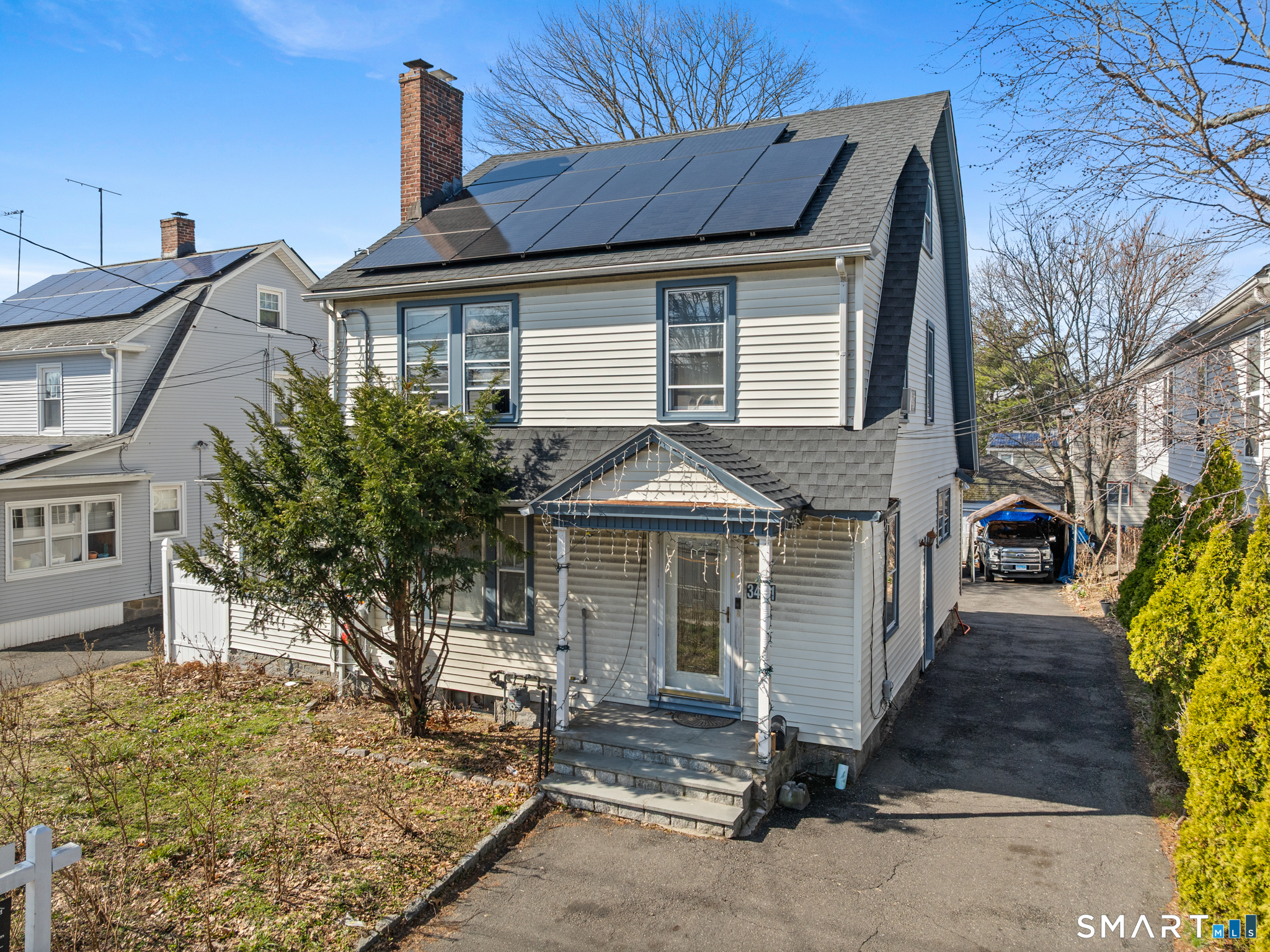 3461 East Main Street Bridgeport, CT 06606 - Photo 2 of 68 a front view of a house with garden