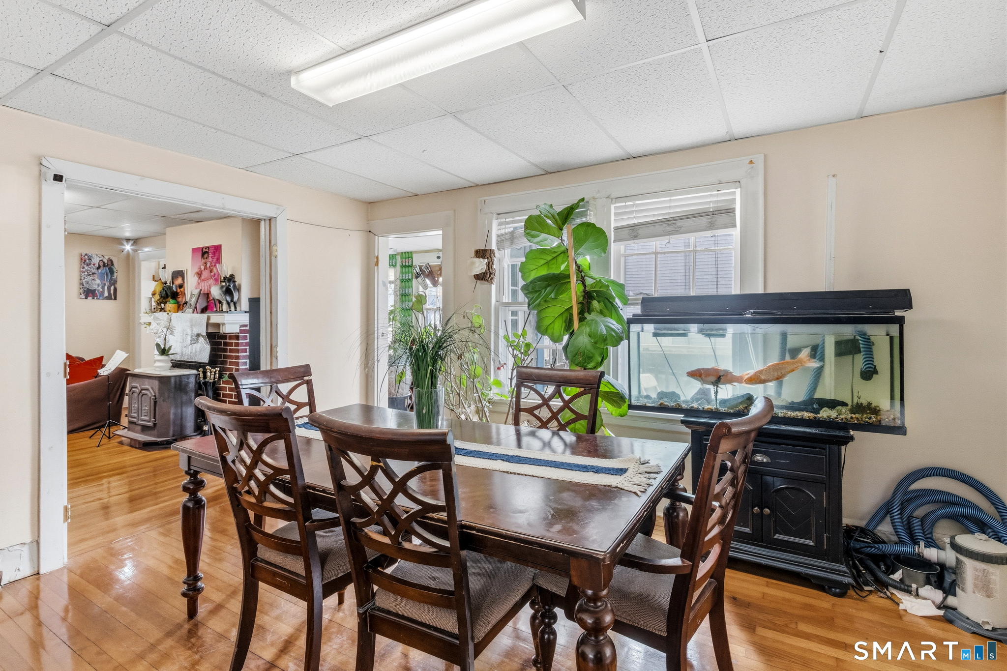3461 East Main Street Bridgeport, CT 06606 - Photo 22 of 68 a view of a dining room with furniture a chandelier and a window