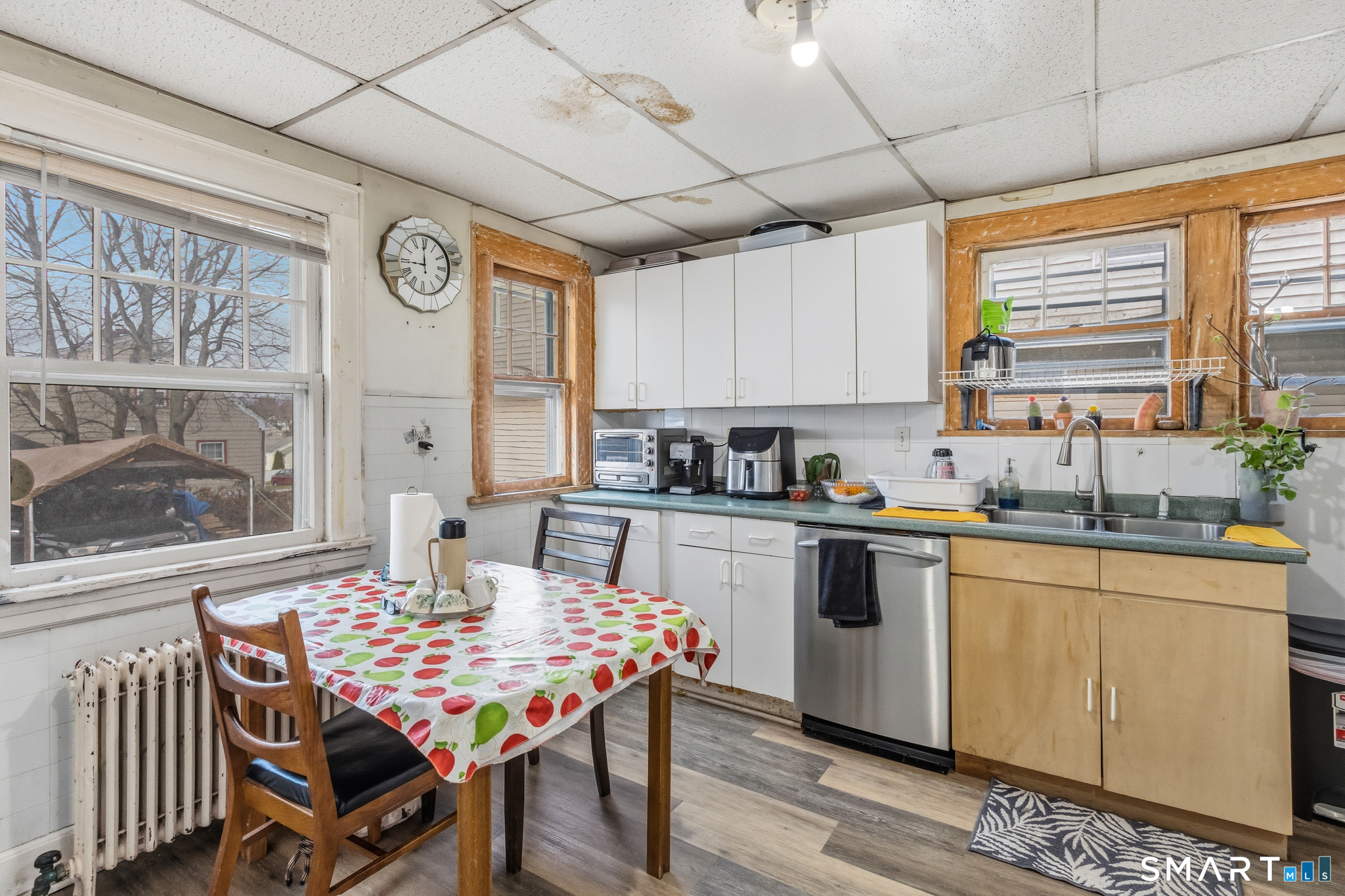 3461 East Main Street Bridgeport, CT 06606 - Photo 24 of 68 a kitchen with a dining table chairs and large window